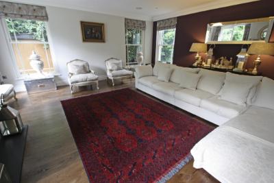 Red Afghan rug in a living room